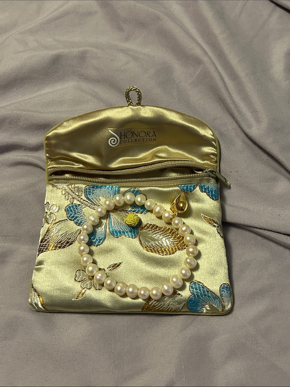 Honora Gold tone  stretch, pearl  bracelet  with Blue & Brown Embroidered pouch